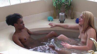 Ebony lesbian and her blonde girlfriend fuck in the tub on lesbiandaughter.com