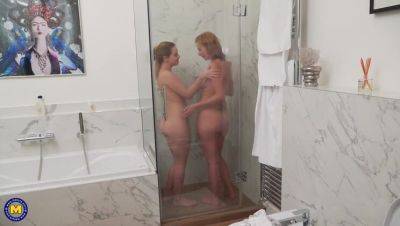 Mature star Effie Gold enjoys a steamy lesbian shower with Karry on lesbiandaughter.com